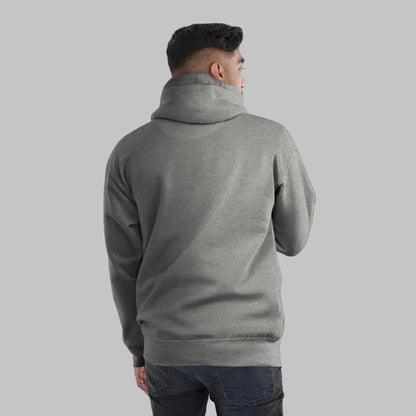 Person wearing a gray hoodie from behind on a dark background